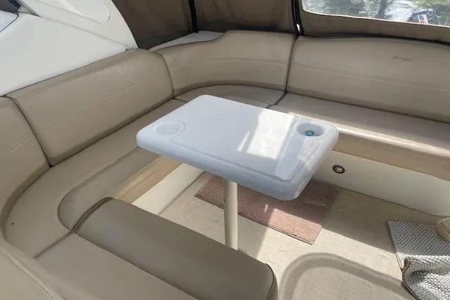  Yacht Photos Pics 2011 Cruisers Yachts 360 Express interior with beige seating and a white table.