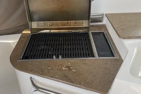  Yacht Photos Pics Built-in grill on 2011 Cruisers Yachts 360 Express, featuring a sleek countertop design.