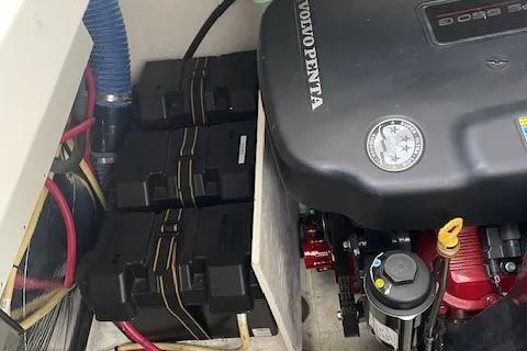  Yacht Photos Pics 2011 Cruisers Yachts 360 Express engine compartment with Volvo Penta engine and battery setup.