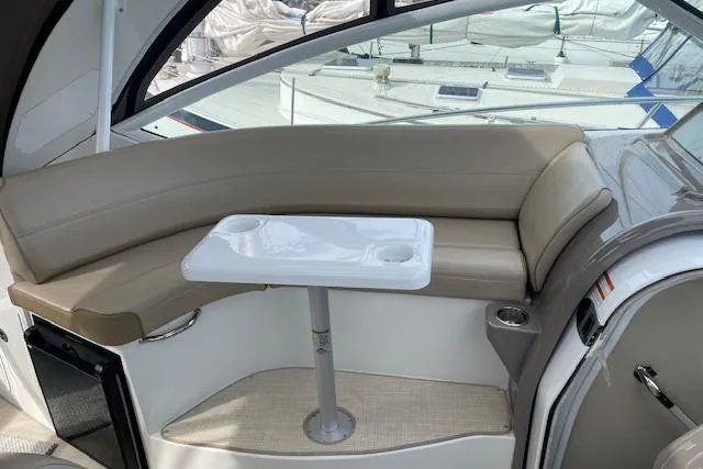  Yacht Photos Pics Interior of 2011 Cruisers Yachts 360 Express with beige seating and a small table.