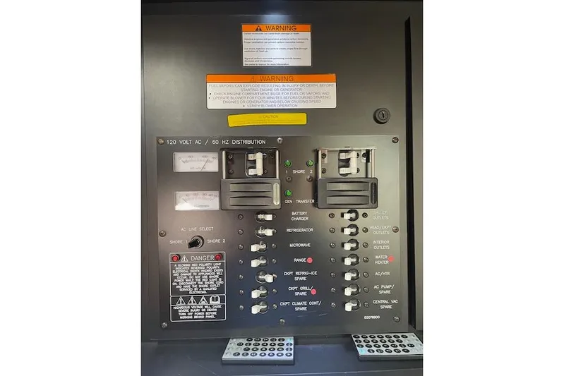  Yacht Photos Pics Electrical panel of 2011 Cruisers Yachts 360 Express with warning labels and switches.