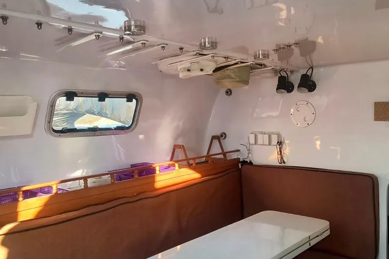 Wingnut Yacht Photos Pics Interior of a 2012 Hughes 40 boat with seating and window.