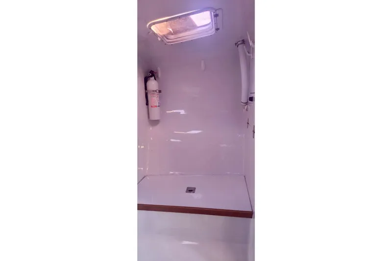 Wingnut Yacht Photos Pics Interior of a 2012 Hughes 40 boat with a fire extinguisher and hatch.