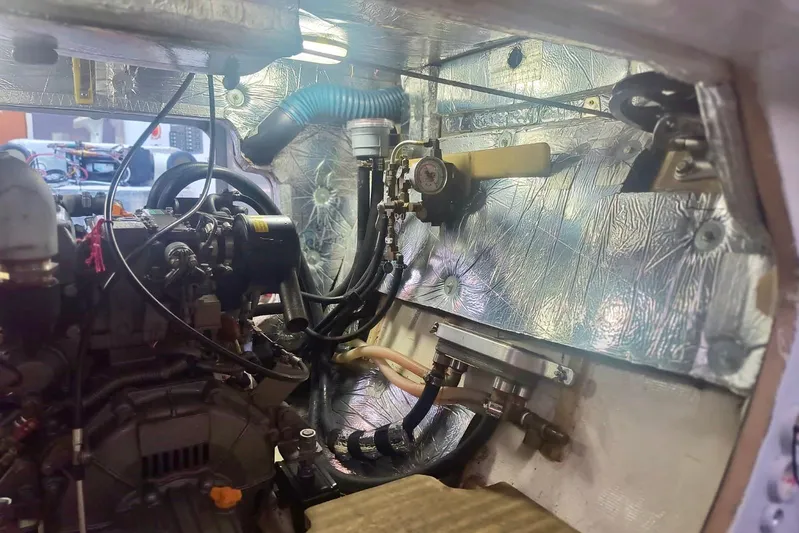 Wingnut Yacht Photos Pics Engine compartment of a 2012 Hughes 40, showcasing mechanical components and insulation.
