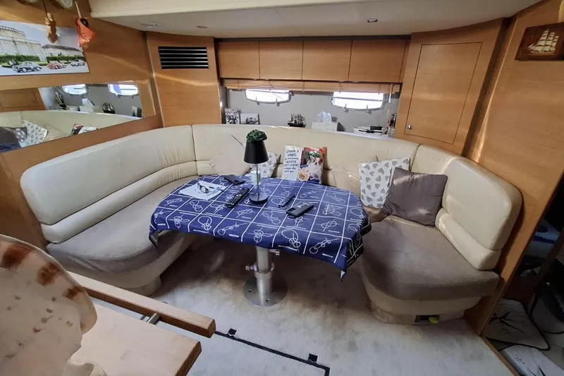  Yacht Photos Pics Luxurious interior of 2009 Fairline Targa 52 MK3 yacht with cozy seating and nautical decor.