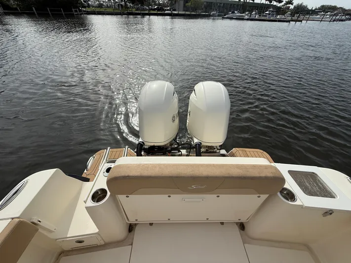  Yacht Photos Pics 2020 Scout 277 LXF boat with dual engines on a calm waterway.