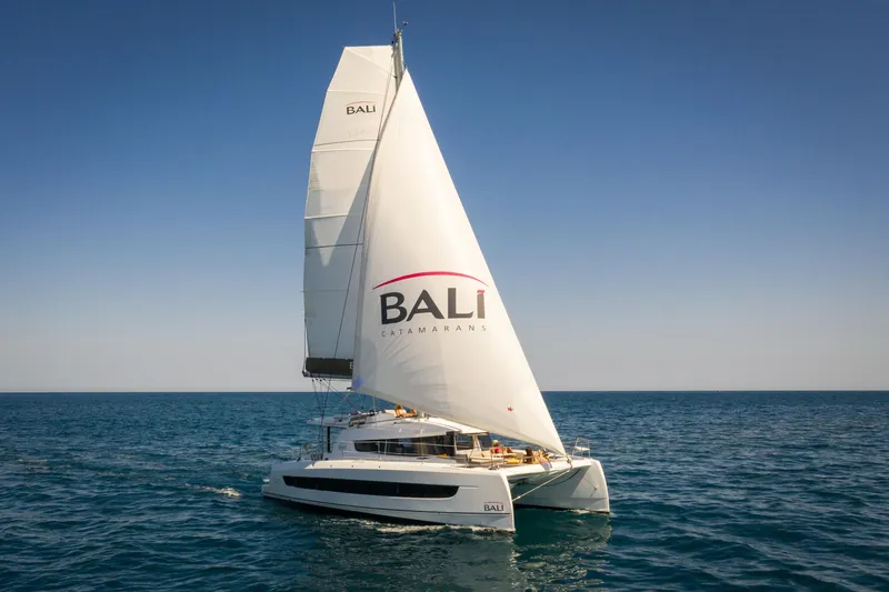  Yacht Photos Pics 2026 Bali 4.2 catamaran sailing on open sea under clear blue sky.