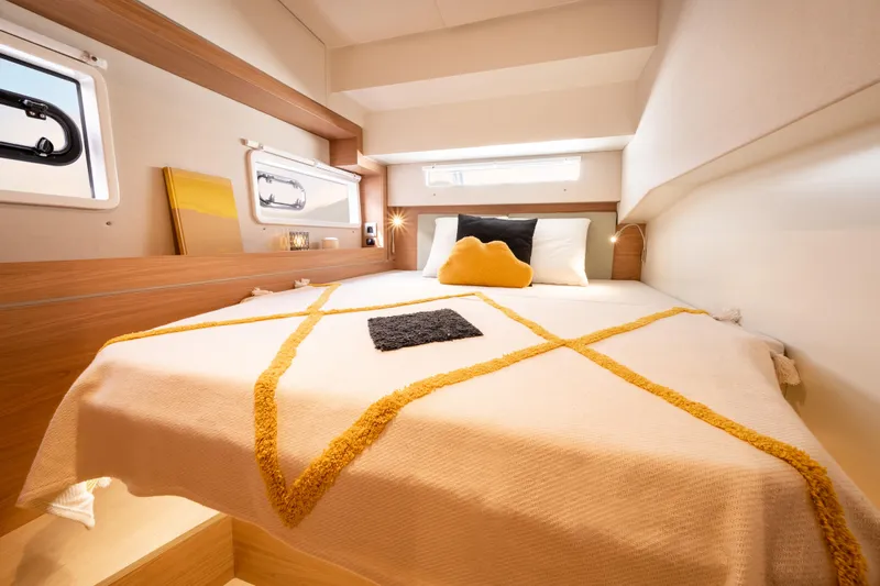  Yacht Photos Pics Luxurious cabin interior of 2026 Bali 4.2 yacht with cozy bed and modern decor.