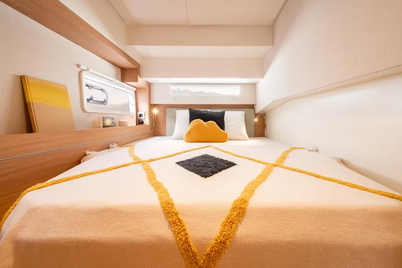  Yacht Photos Pics Luxurious cabin interior of 2026 Bali 4.2 yacht with cozy bedding and modern design.