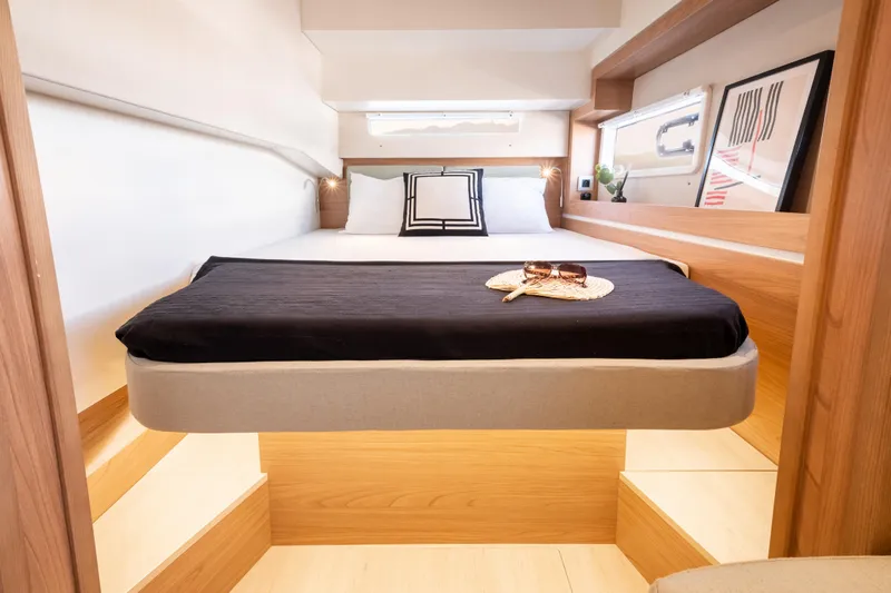  Yacht Photos Pics Luxurious cabin interior of 2026 Bali 4.2 yacht with modern bedding and decor.