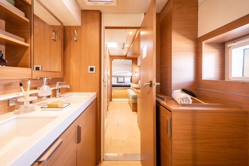  Yacht Photos Pics Luxurious interior of 2026 Bali 4.2 yacht, featuring modern wooden cabinetry and sleek design.