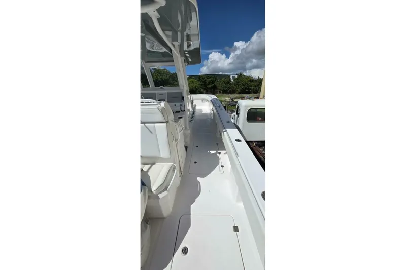 Hit N Run Yacht Photos Pics 2020 Invincible 35 Catamaran deck view under clear blue sky.