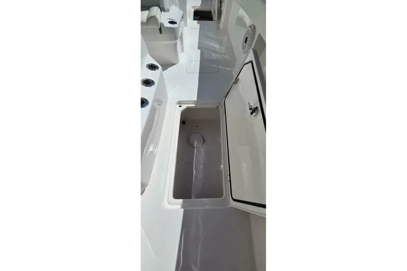 Hit N Run Yacht Photos Pics 2020 Invincible 35 Catamaran interior with open storage compartment.