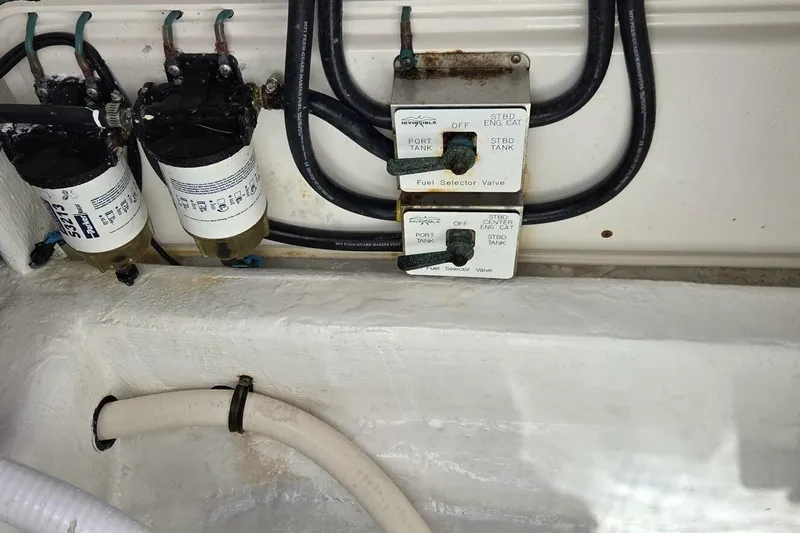 Hit N Run Yacht Photos Pics Fuel selector valves and filters in a 2020 Invincible 35 Catamaran engine compartment.
