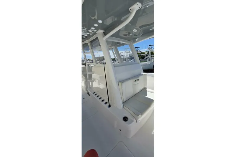 Hit N Run Yacht Photos Pics 2020 Invincible 35 Catamaran interior with seating and sleek design.
