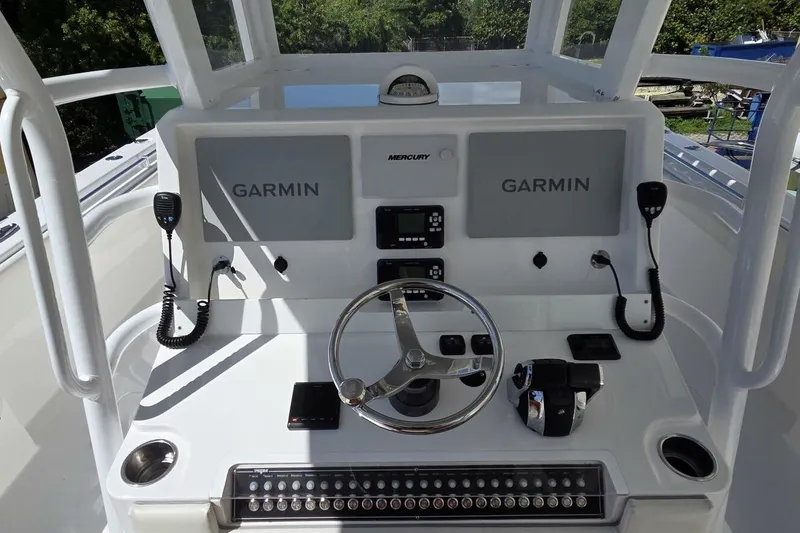 Hit N Run Yacht Photos Pics 2020 Invincible 35 Catamaran helm with Garmin displays and Mercury controls.