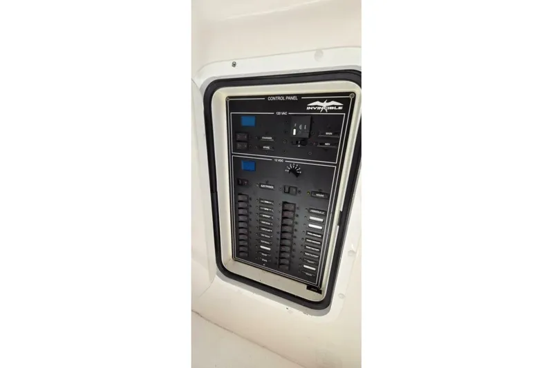 Hit N Run Yacht Photos Pics Control panel of 2020 Invincible 35 Catamaran, featuring switches and indicators.