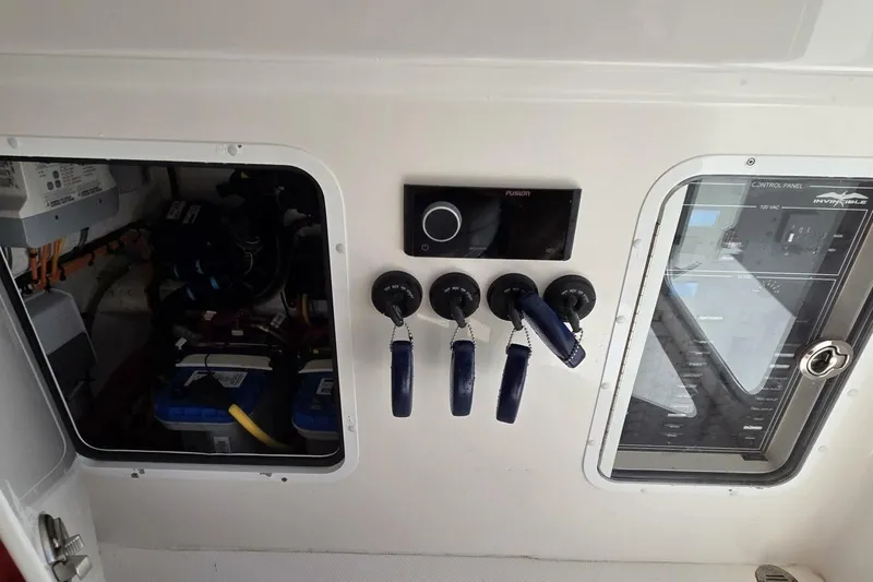 Hit N Run Yacht Photos Pics Control panel of 2020 Invincible 35 Catamaran with switches and wiring.