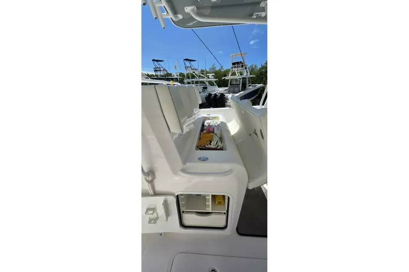 Hit N Run Yacht Photos Pics 2020 Invincible 35 Catamaran interior view with open storage compartments.