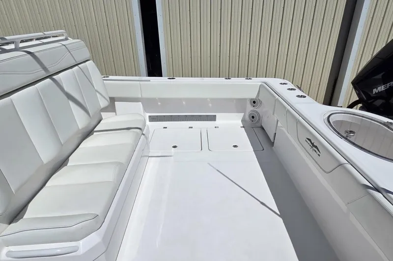 Hit N Run Yacht Photos Pics 2020 Invincible 35 Catamaran interior with white seating and fishing amenities.