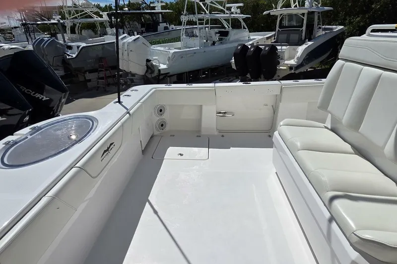 Hit N Run Yacht Photos Pics 2020 Invincible 35 Catamaran interior with seating and fishing equipment.