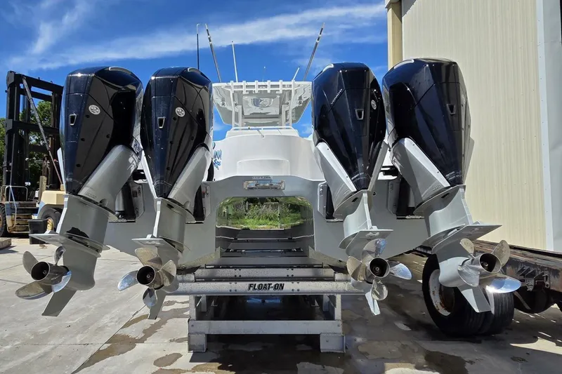 Hit N Run Yacht Photos Pics 2020 Invincible 35 Catamaran with four powerful outboard engines on a trailer.