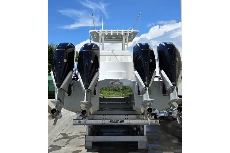 Hit N Run Yacht Photos Pics 2020 Invincible 35 Catamaran with four powerful outboard engines on a trailer.