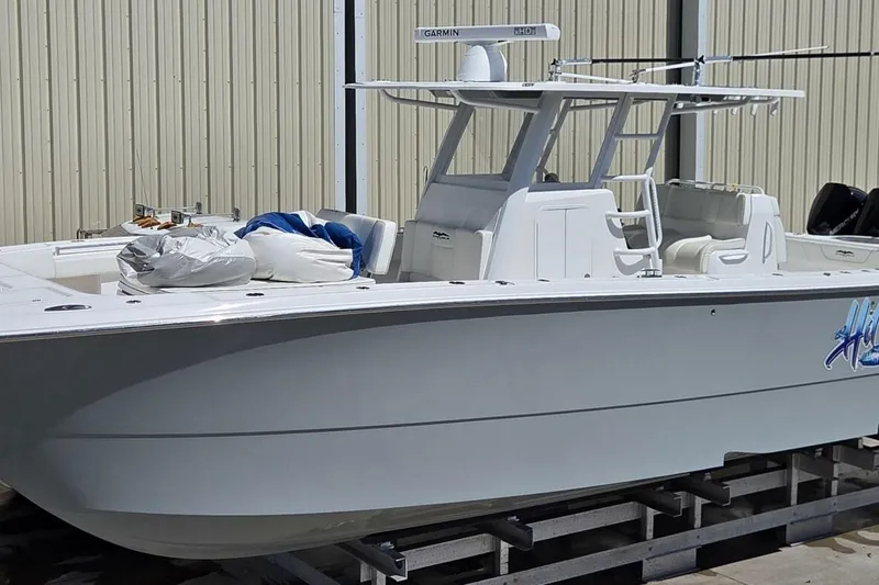 Hit N Run Yacht Photos Pics 2020 Invincible 35 Catamaran boat docked, featuring sleek design and modern equipment.