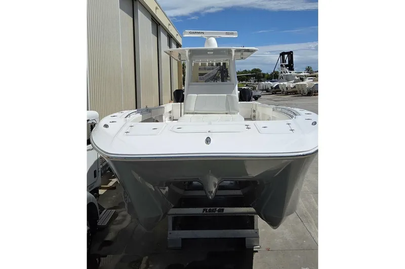 Hit N Run Yacht Photos Pics 2020 Invincible 35 Catamaran in a boatyard, showcasing sleek design and modern features.