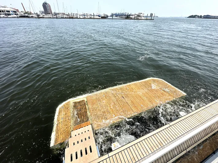 Perpetually Investing Yacht Photos Pics Boat platform of 2022 Prestige 520 yacht on water, near marina.