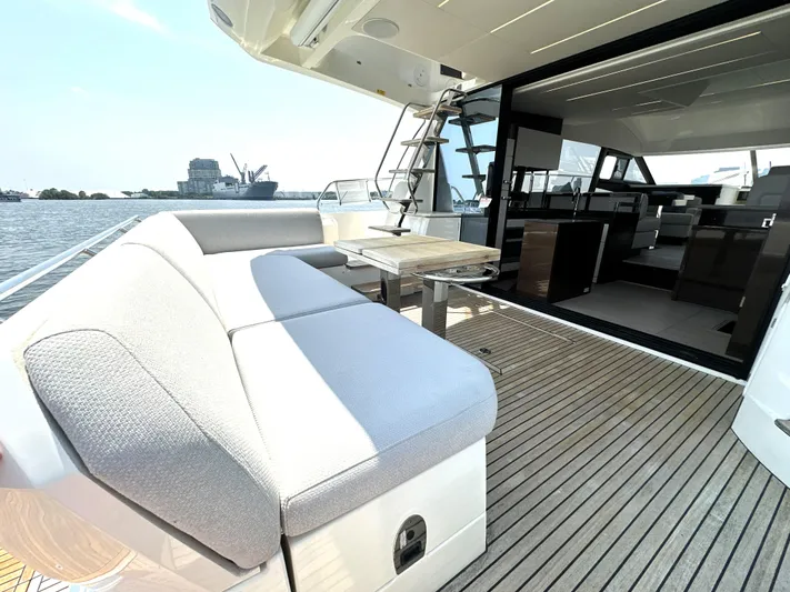 Perpetually Investing Yacht Photos Pics Luxury 2022 Prestige 520 yacht with spacious deck and modern interior design.