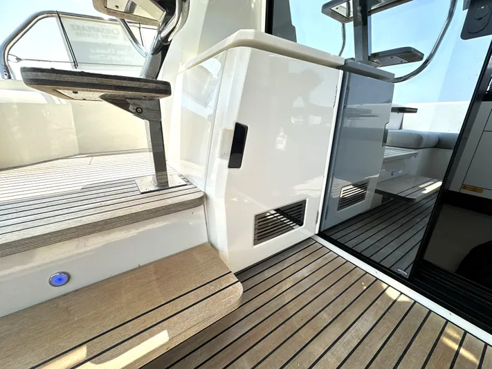 Perpetually Investing Yacht Photos Pics Prestige 520 yacht interior, 2022 model, featuring sleek design and wooden flooring.