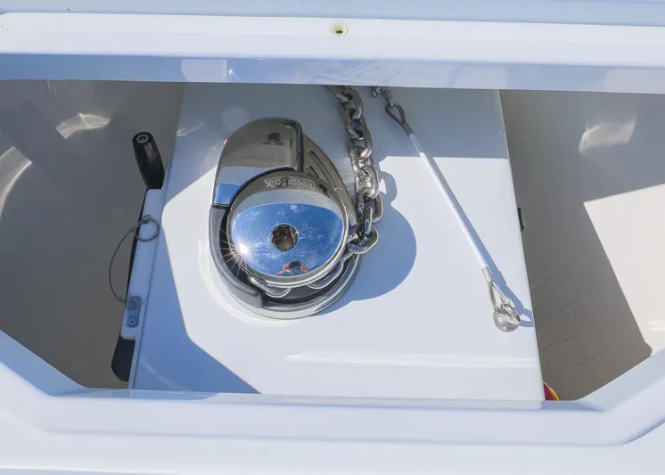  Yacht Photos Pics Anchor compartment of 2025 Invincible 39 Open Fisherman boat, featuring a shiny metal winch.