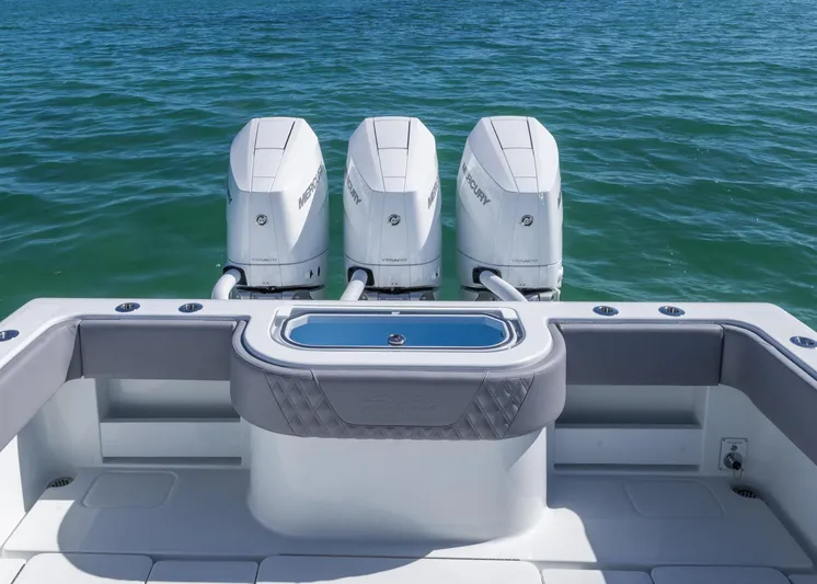  Yacht Photos Pics 2025 Invincible 39 Open Fisherman with triple outboard engines on the ocean.