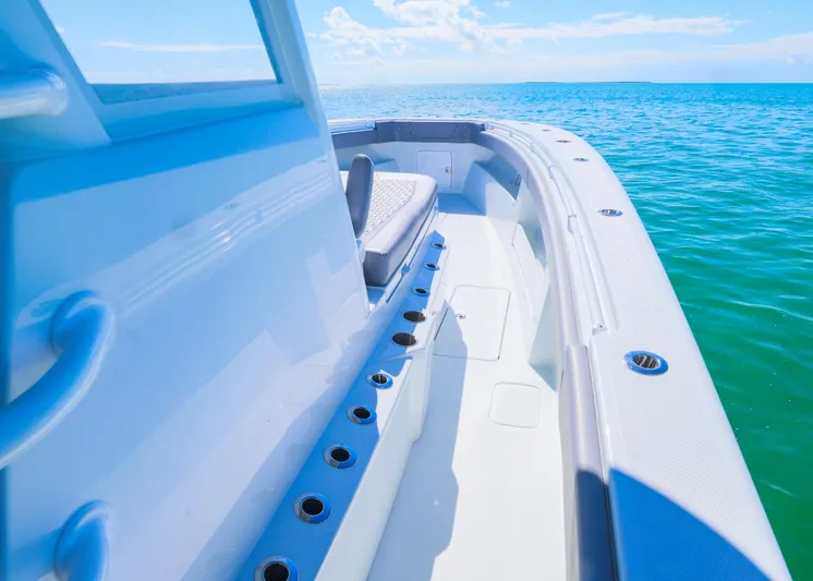  Yacht Photos Pics 2025 Invincible 39 Open Fisherman boat on clear blue water.