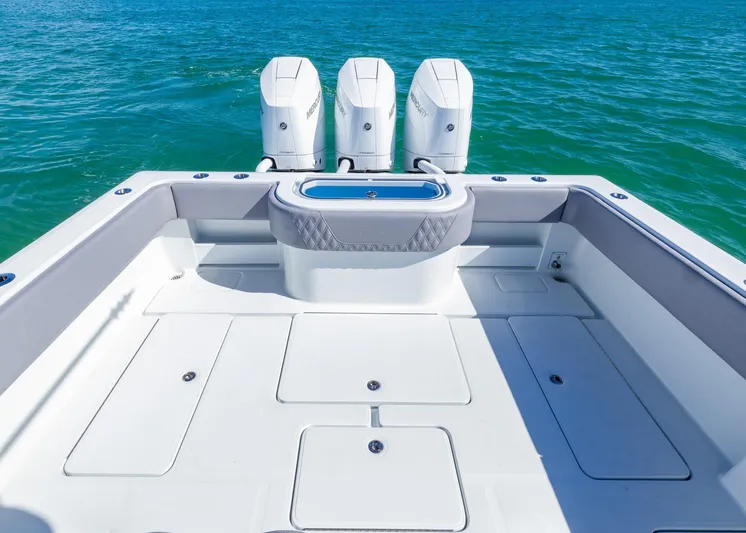  Yacht Photos Pics 2025 Invincible 39 Open Fisherman boat with triple engines on blue water.