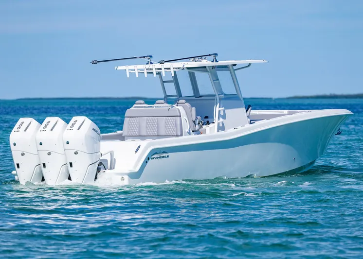  Yacht Photos Pics 2025 Invincible 39 Open Fisherman boat on clear blue water.