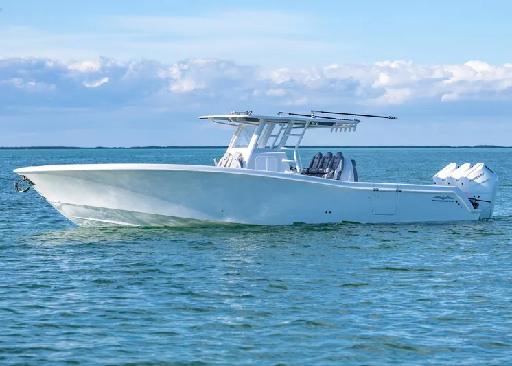  Yacht Photos Pics 2025 Invincible 39 Open Fisherman boat on calm ocean waters.