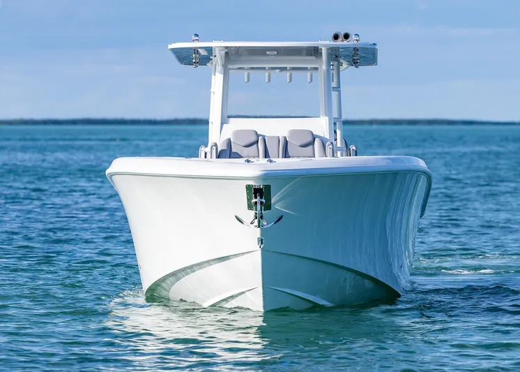  Yacht Photos Pics 2025 Invincible 39 Open Fisherman boat on calm blue water.