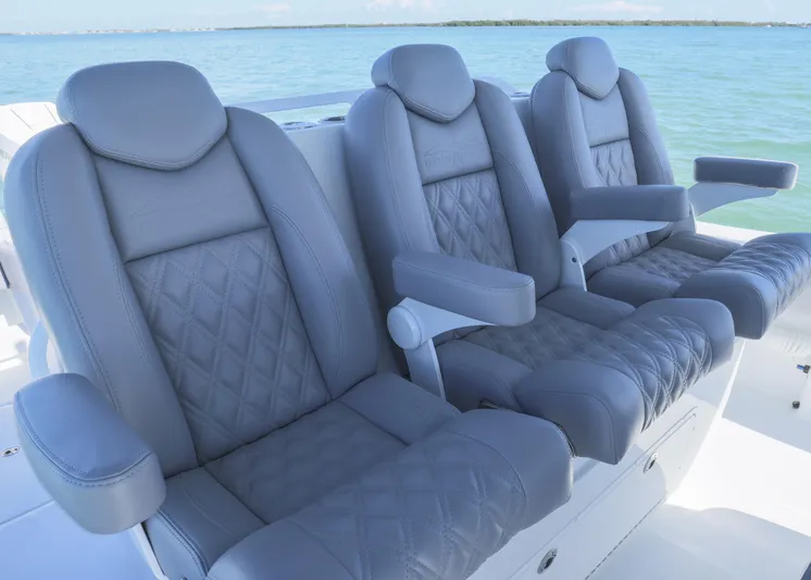  Yacht Photos Pics Luxurious seating on 2025 Invincible 39 Open Fisherman boat, featuring elegant design and comfort.