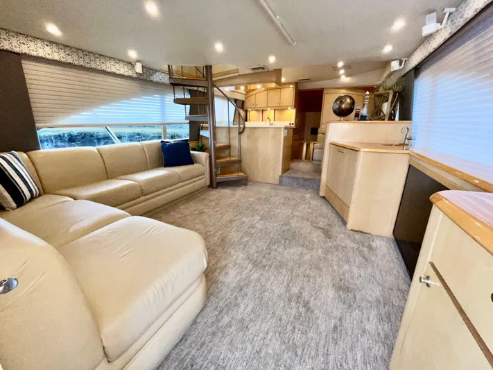 Snow Bank Yacht Photos Pics Luxurious interior of 2003 Ocean Yachts 62 Enclosed Bridge with plush seating and modern design.