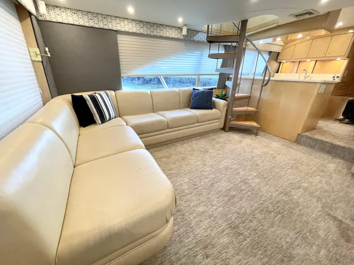 Snow Bank Yacht Photos Pics Luxurious interior of 2003 Ocean Yachts 62 Enclosed Bridge with plush seating and modern design.