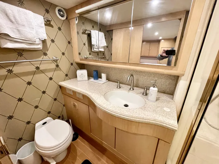 Snow Bank Yacht Photos Pics Luxurious bathroom in 2003 Ocean Yachts 62 Enclosed Bridge, featuring modern fixtures and elegant design.