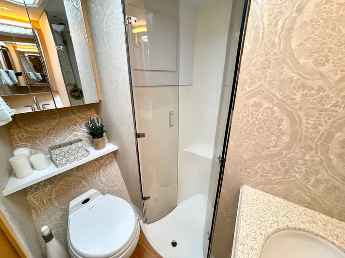 Snow Bank Yacht Photos Pics Luxurious bathroom in 2003 Ocean Yachts 62 Enclosed Bridge with elegant decor and modern amenities.