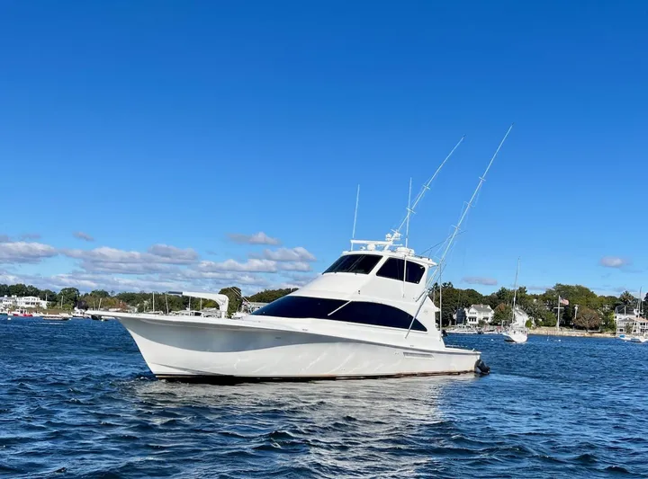 Snow Bank Yacht Photos Pics 2003 Ocean Yachts 62 Enclosed Bridge on calm water under clear blue sky.