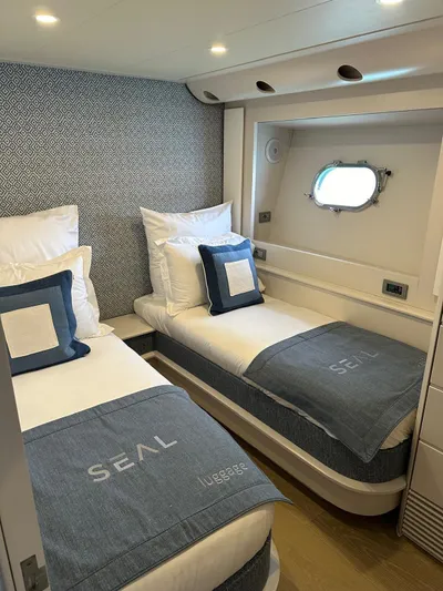  Yacht Photos Pics Twin cabin in 2005 Baia Atlantica 78 yacht with modern decor and porthole window.