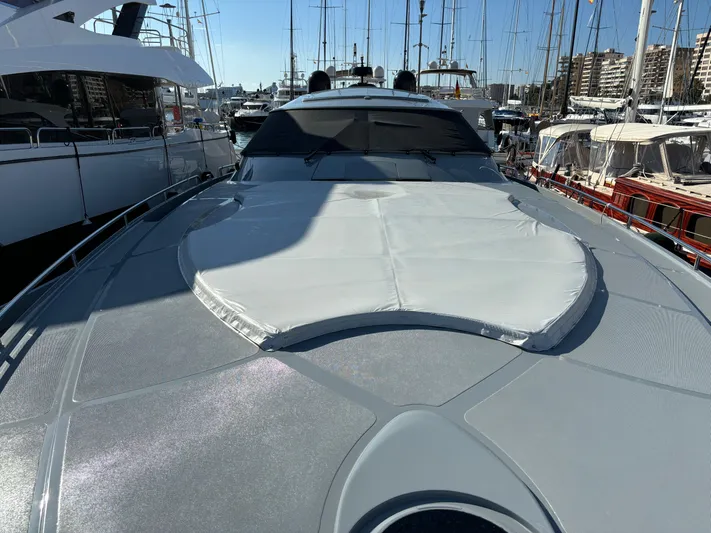  Yacht Photos Pics 2005 Baia Atlantica 78 yacht docked in a marina, showcasing sleek design and sunbathing area.