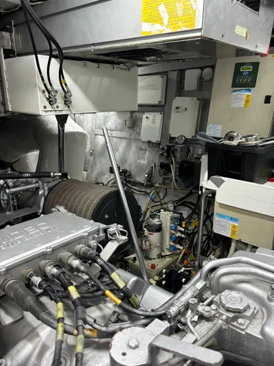  Yacht Photos Pics Engine room of 2005 Baia Atlantica 78 yacht, showcasing mechanical components and wiring.
