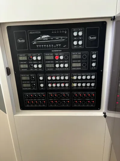  Yacht Photos Pics Control panel of a 2005 Baia Atlantica 78 yacht, featuring various switches and indicators.