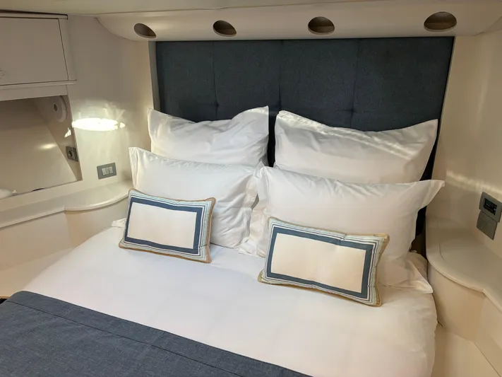  Yacht Photos Pics Luxurious cabin interior of 2005 Baia Atlantica 78 yacht with plush bedding.